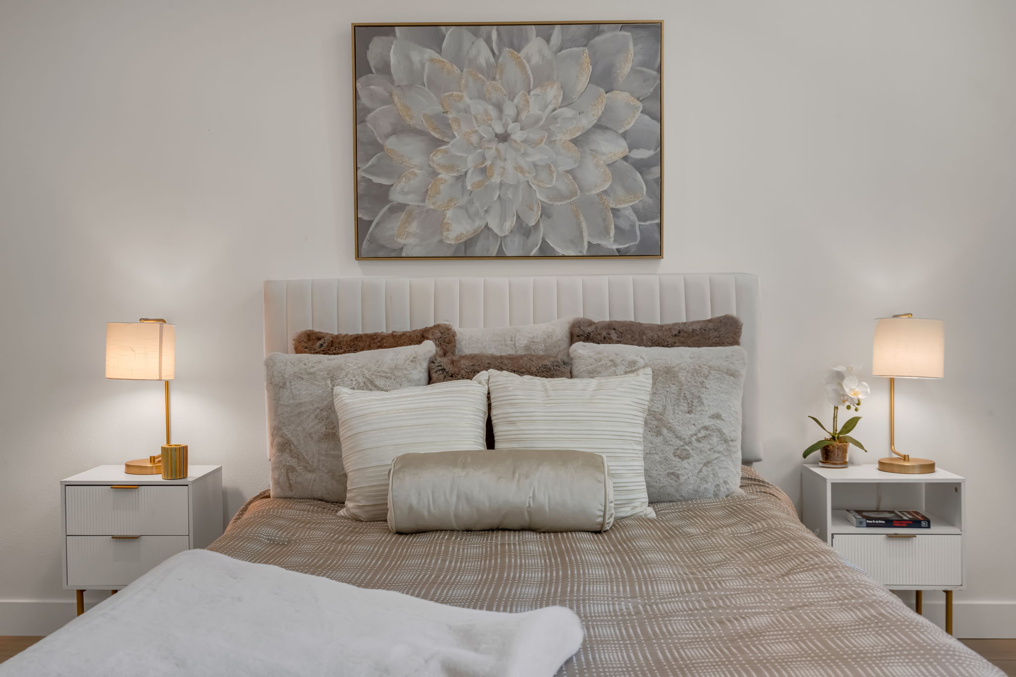 Primary bedroom — queen bed with luxury staging